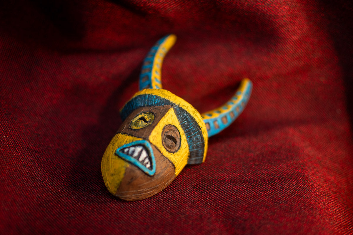 Umbala Warrior Mask on Red Background